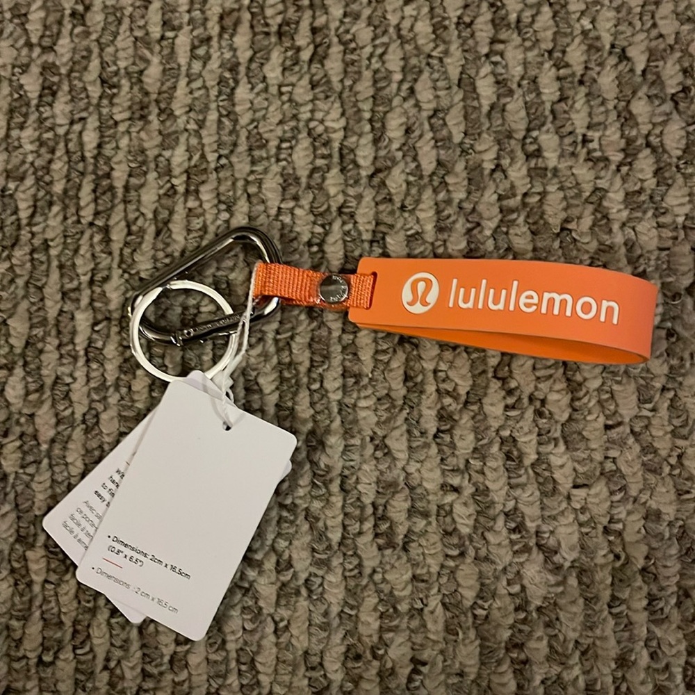 Lululemon Silicone Key Chain Color: Lulu Coral/White Size OS NWT